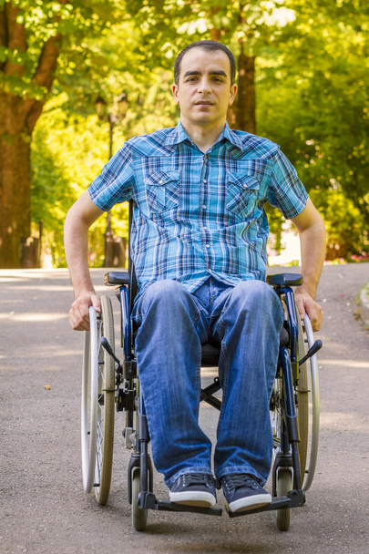 young man in wheelchair - Foto, Imagen