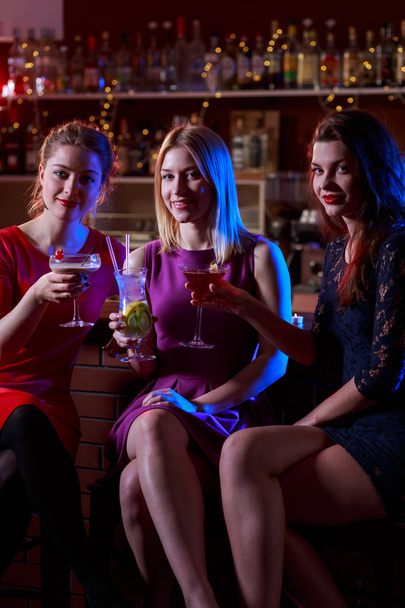 Three female friends in bar - Fotó, kép