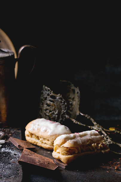 Eclairs with white chocolate - 写真・画像