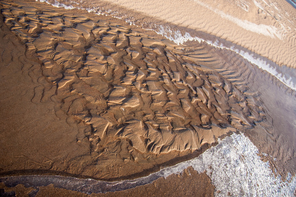 La textura de la arena. Arena en la naturaleza salvaje
 - Foto, Imagen