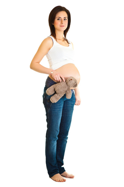 Brunette pregnant woman with teddy bear isolated on white - Φωτογραφία, εικόνα