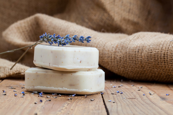 Bars of soap with lavender on a rustic wooden background - Fotografie, Obrázek