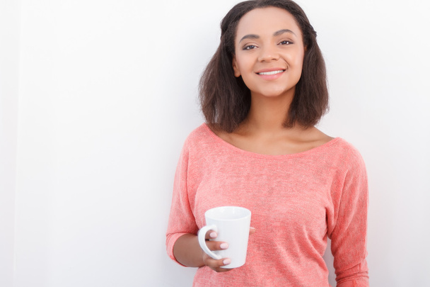 Pretty mulatto girl posing with cup  - Photo, Image