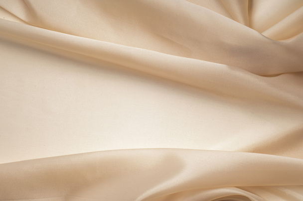 tissue, textile, cloth, fabric, material, texture. beige color. cloth, typically produced by weaving or knitting textile fibers. - Φωτογραφία, εικόνα