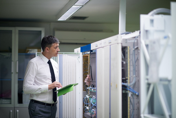 network engineer working in  server room - Fotografie, Obrázek