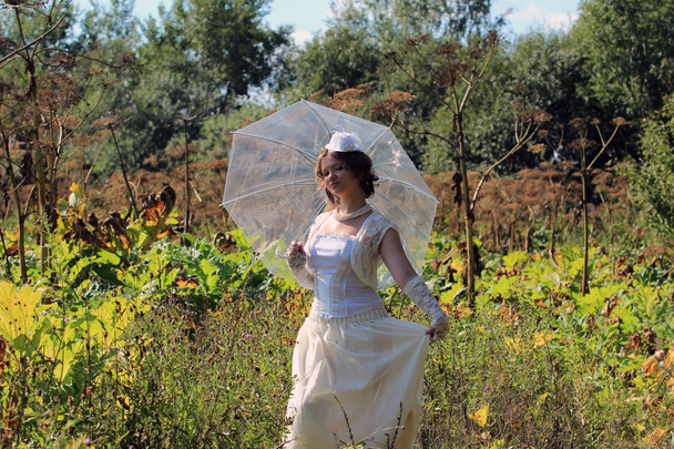 Girl in the white dress and umbrella - Photo, Image