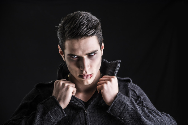 Portrait of a Young Vampire Man with Black Sweater - Φωτογραφία, εικόνα