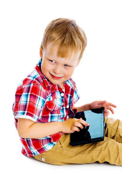 boy with a Tablet PC sitting on the floor - Photo, image
