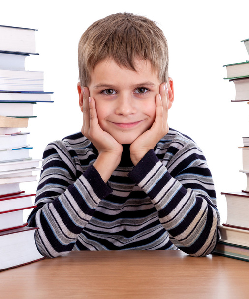 Schoolboy and a heap of books - Фото, изображение