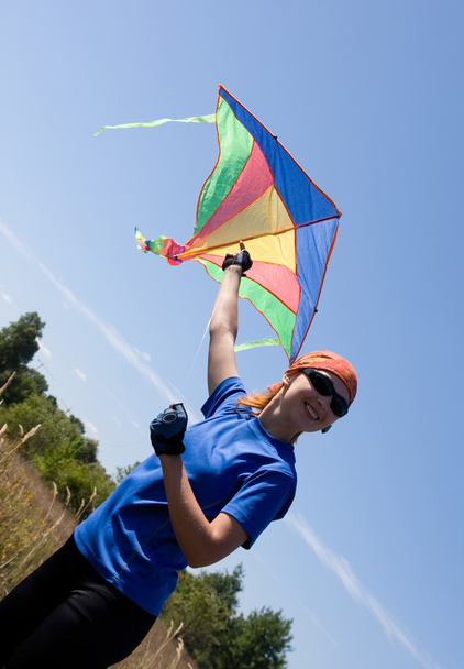 Happy girl flying kite - Fotó, kép