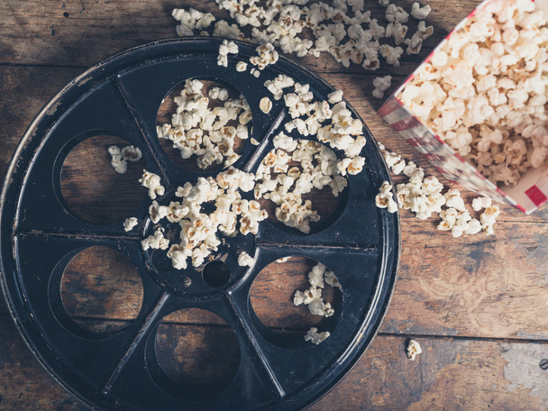 Film reel and popcorn - Foto, imagen