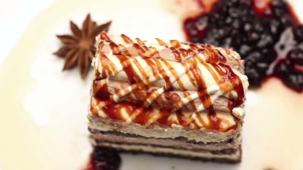 Cake with exceptional ornament and sweet syrup topping, rotating - Filmati, video