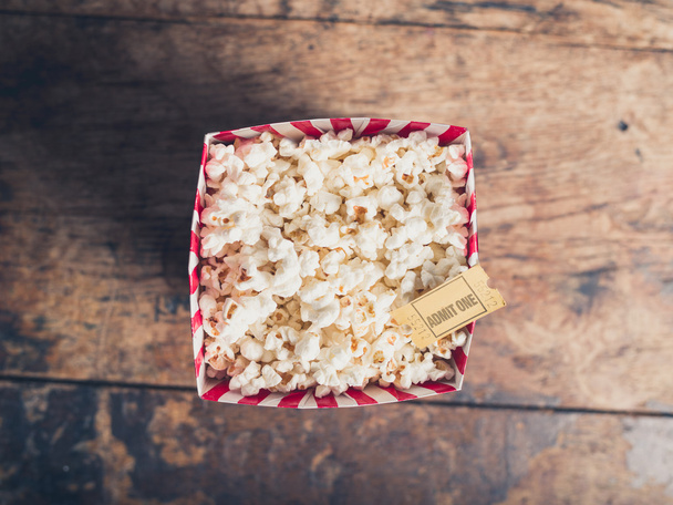 Popcorn and cinema ticket - Foto, afbeelding