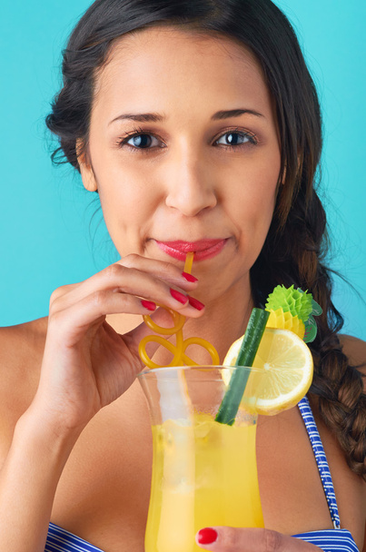 Woman drinking a cocktail - Foto, imagen