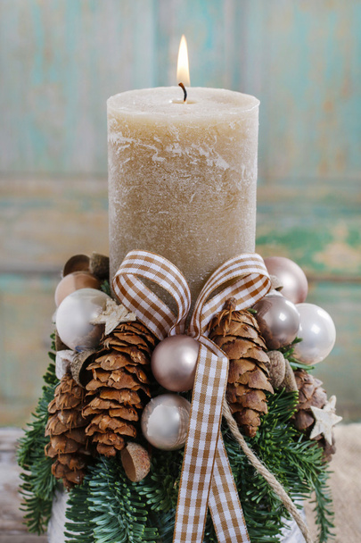 Christmas decoration with candle and cones - Foto, Imagen