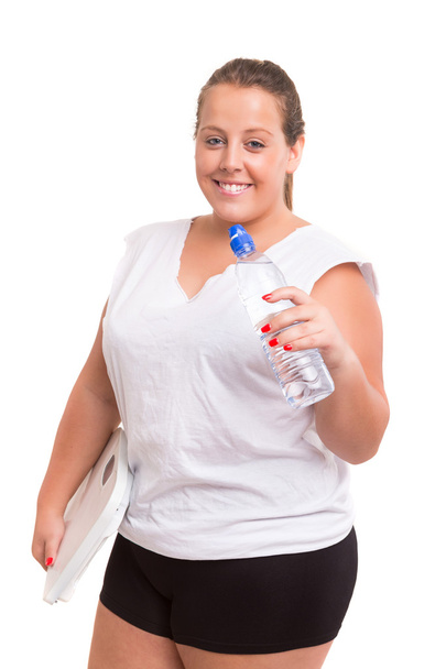 Large Woman exercising with bottle of water - Photo, Image
