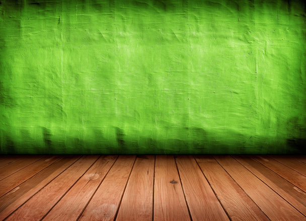 Dark vintage green room with wooden floor and artistic shadows a - Photo, image