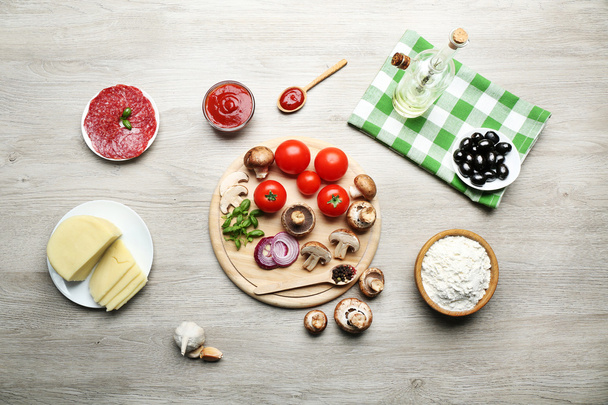 Ingredients for cooking pizza on wooden table, top view - Fotó, kép