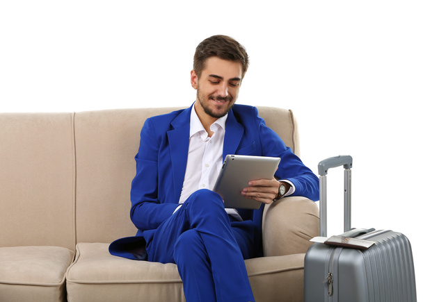Businessman with suitcase and tablet - Fotoğraf, Görsel