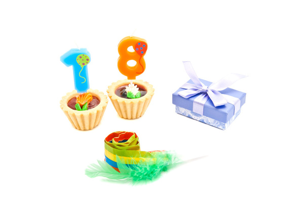 cakes with eighteen years birthday candles, whistle and gift  - Фото, зображення