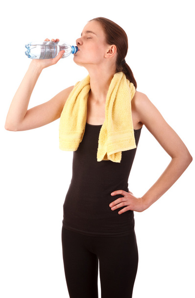 Sporty girl drinking water - Fotó, kép