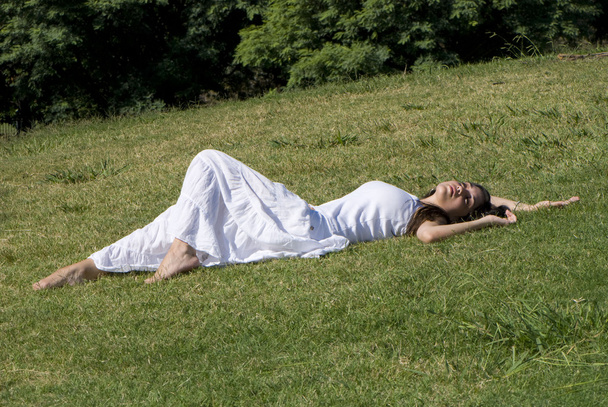 Relaxing girl on meadow - Foto, Imagen