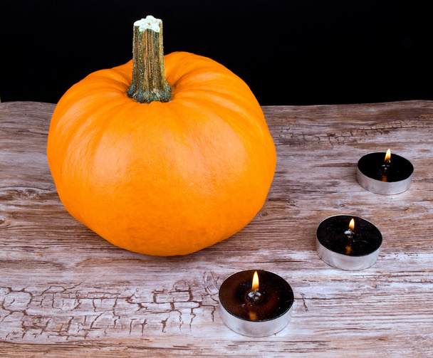 Halloween pumpkin and black candles - Zdjęcie, obraz