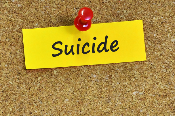 suicide  word on notes paper with cork background - Photo, Image