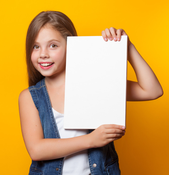 Beautiful young girl with white board  - Foto, afbeelding