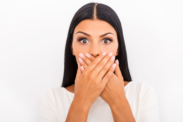 Surprised woman covering mouth with hands - Foto, Imagem