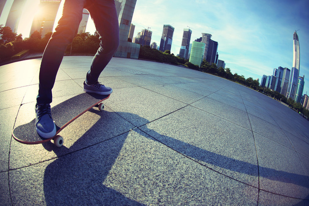 female skateboarding at city - Foto, Imagen