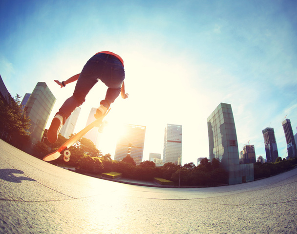 female skateboarding at city - Photo, Image
