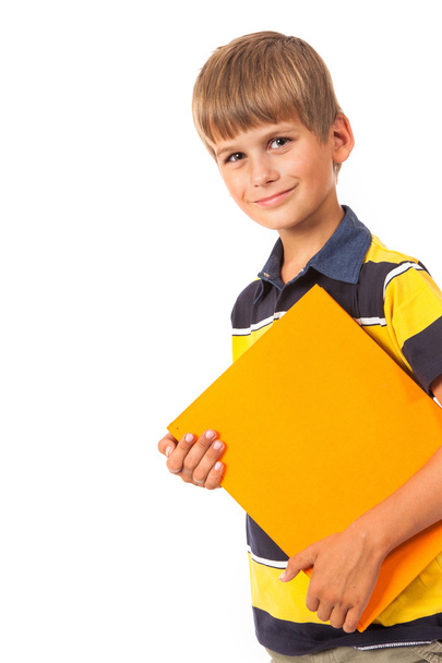 Шкільний хлопчик тримає книжку
 - Фото, зображення