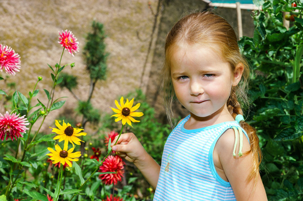 Cute preschooler girl portrait with natural flowers - Photo, Image