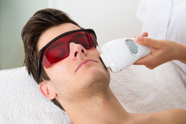 Man Receiving Laser Hair Removal Treatment - Photo, image