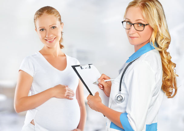 Pregnant woman on reception at doctor - Foto, Bild