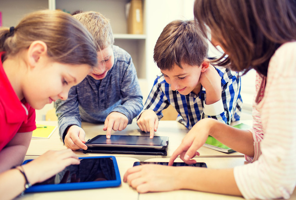 group of school kids with tablet pc in classroom - Zdjęcie, obraz