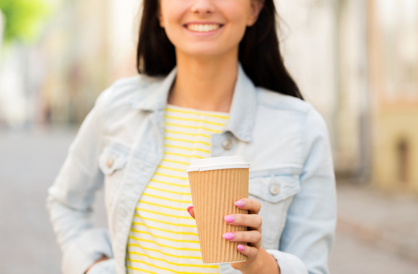 close up of happy young woman drinking coffee - Fotografie, Obrázek