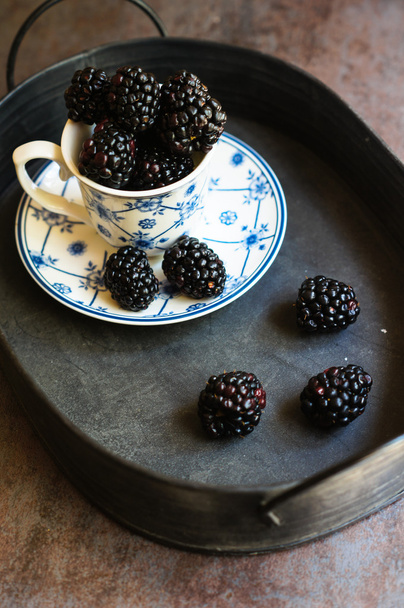 Blackberry fruits in the cup - Фото, изображение