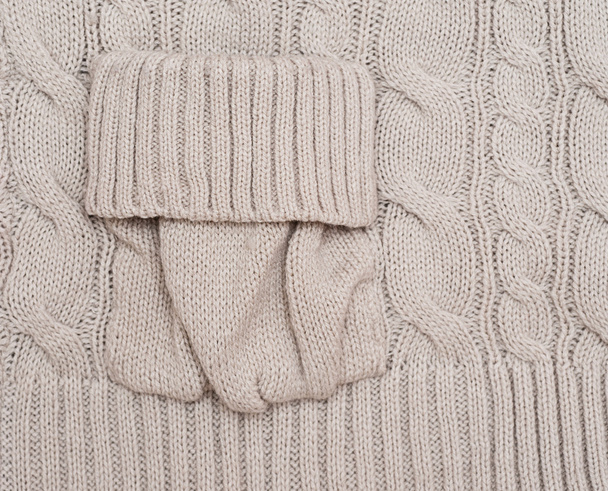 Knitted woolen background with a pocket - Φωτογραφία, εικόνα