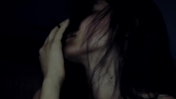 Closeup of desperate lonely woman crying at night in bed - Filmagem, Vídeo