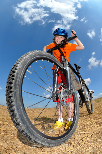 Retrato de una chica con bicicleta
 - Foto, Imagen