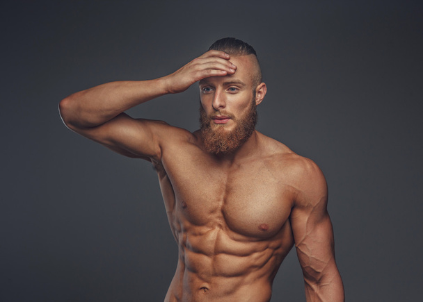 Shirtless muscular man with beard. - Foto, afbeelding