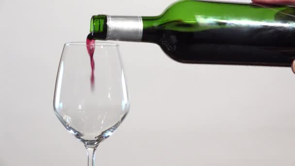 red wine flowing into glass - Кадри, відео