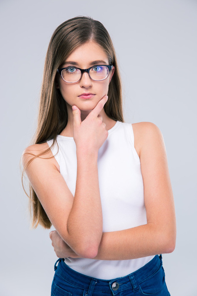Portrait of a thoughtful girl in glasses - Photo, Image