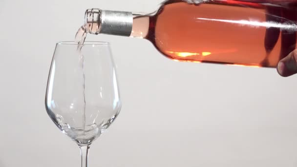 Pink wine flowing into glass - Footage, Video