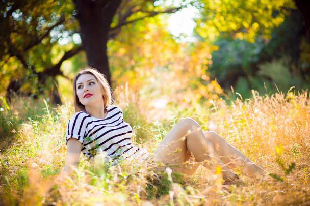 woman in a park at sunset - Photo, image