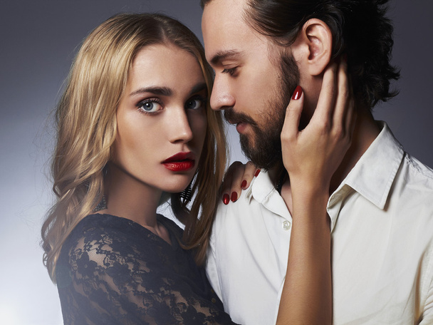 fashionable couple in tender passion. Beautiful woman near handsome man - Foto, afbeelding