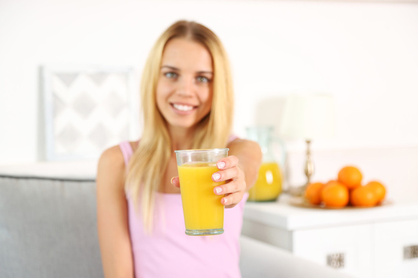 Young beautiful woman with fresh juice  - Фото, изображение