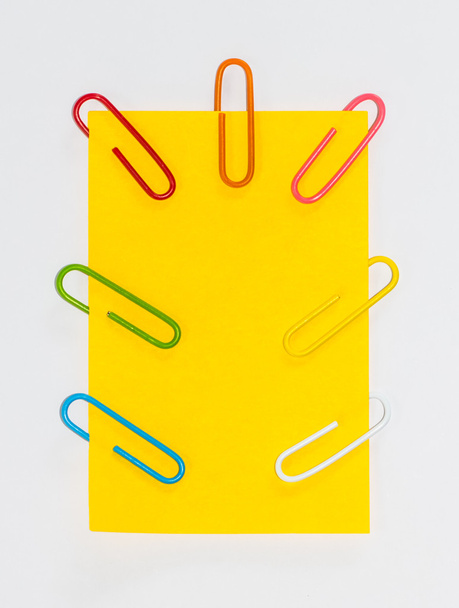 Colorful paperclips and post it on white background isolated - Photo, Image
